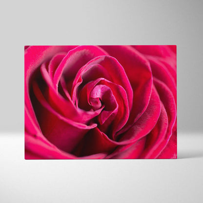 Close-up of vibrant red rose petals on glossy canvas wall art for elegant decor.