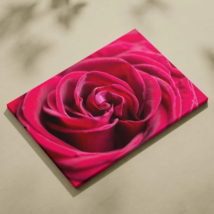 High-resolution canvas wall art featuring a vibrant close-up of a deep pink rose with detailed petals for elegant home decor.