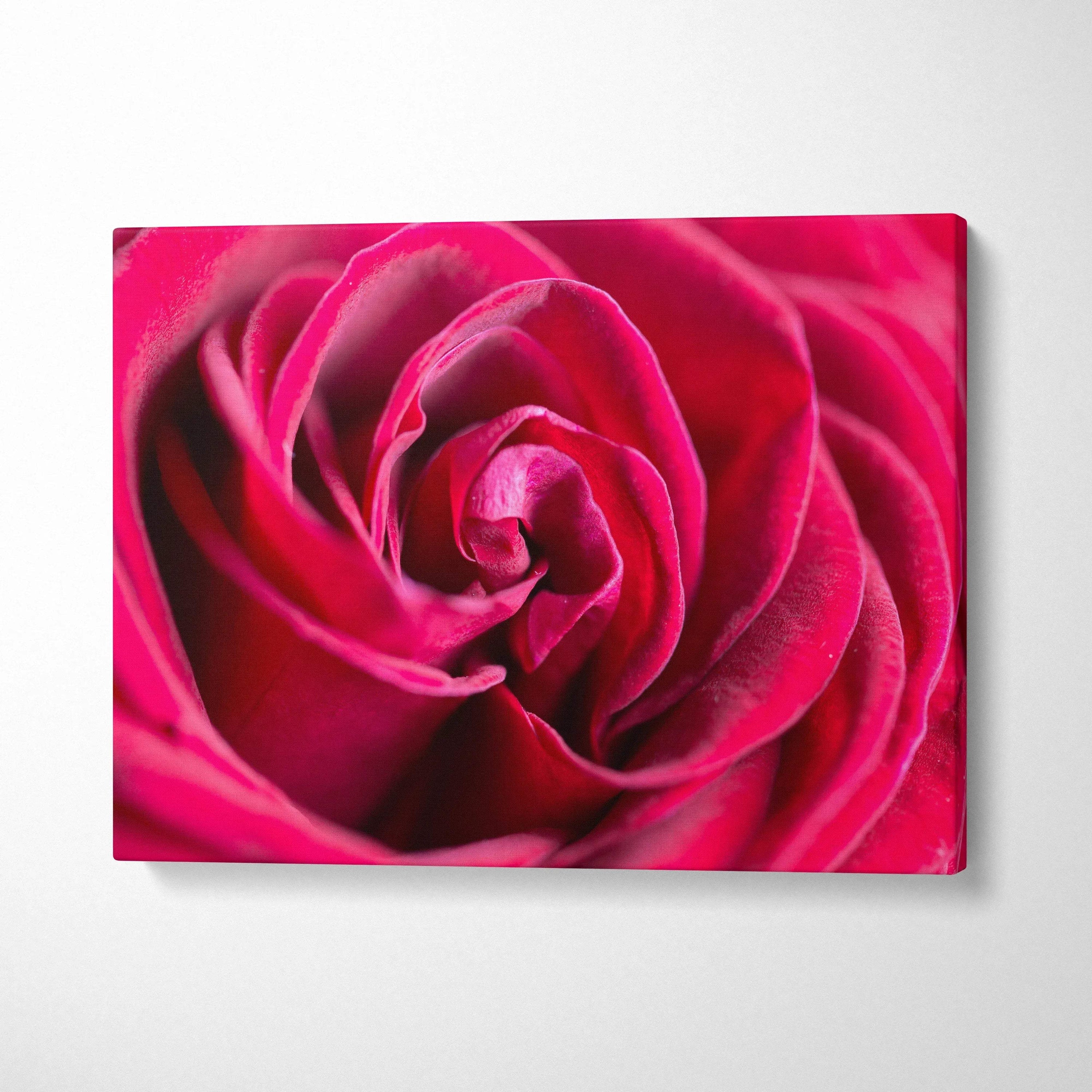 Close-up of vibrant red rose petals on canvas wall art for elegant home decor.