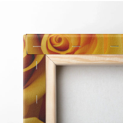 Close-up of canvas wall art corner featuring vibrant yellow rose petals with natural wooden frame edges and visible canvas.