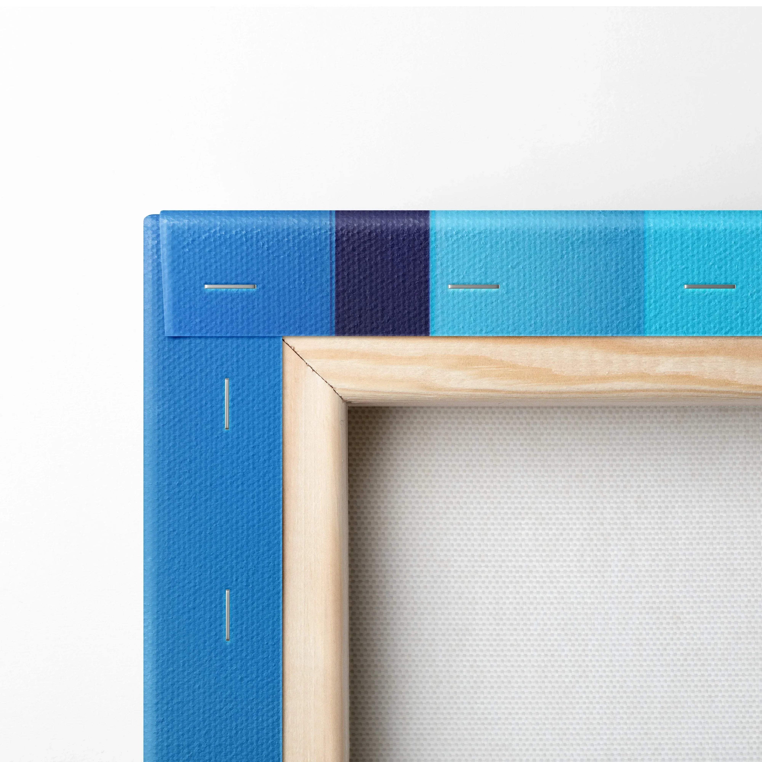 Corner close-up of a wooden stretched canvas with vibrant blue and turquoise abstract design and visible staples.