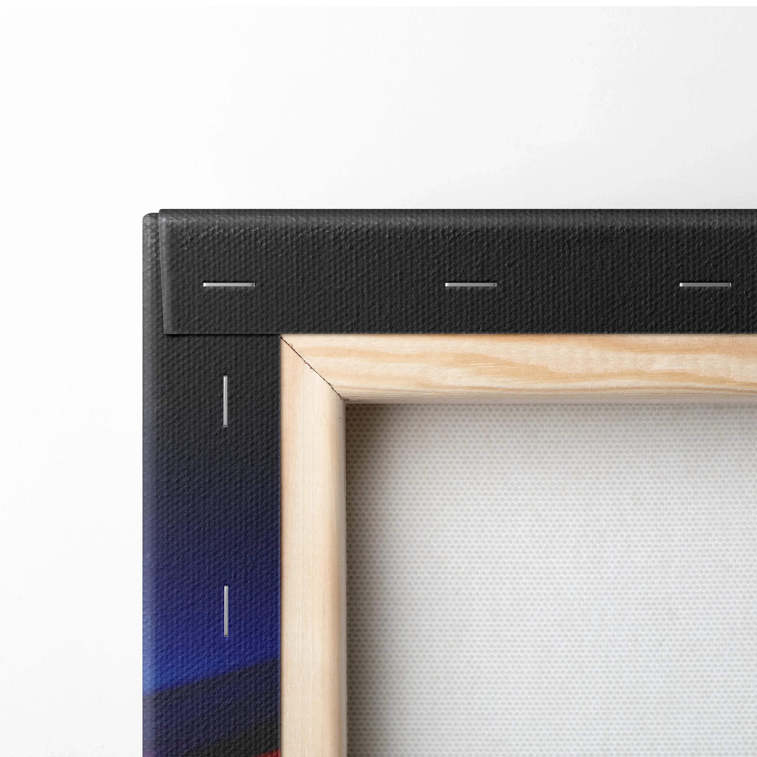 Close-up of wooden frame and black stretched canvas corner with visible staples on modern abstract wall art canvas print.