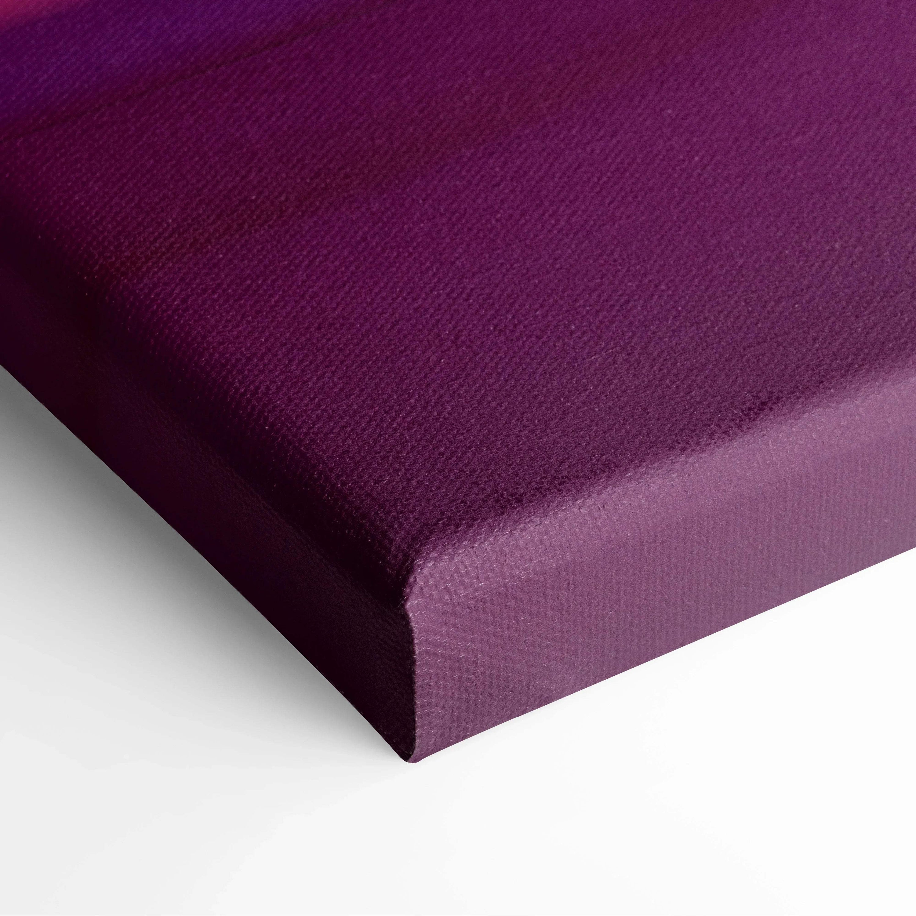 Close-up of deep purple canvas art with textured fabric and wrapped edges.