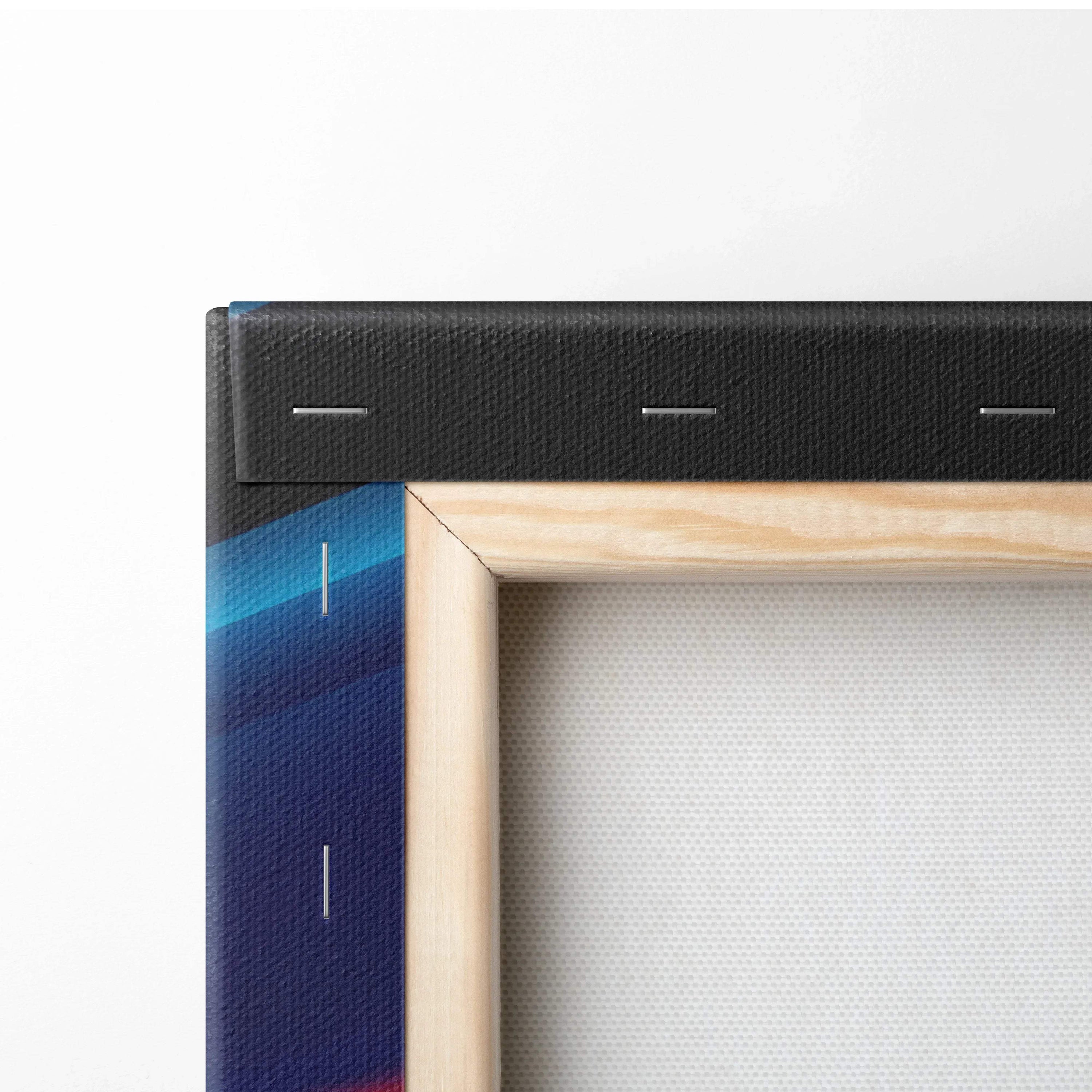 Close-up of vibrant abstract digital canvas wall art with natural wooden stretcher bars and black wrapped sides.