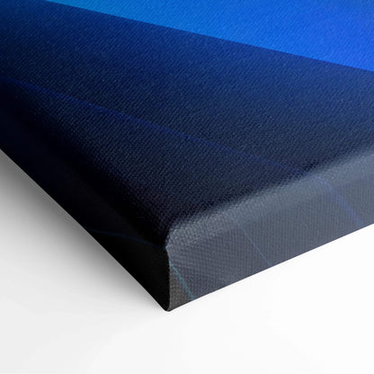 Abstract canvas art with deep blue and black gradient, wrapped edge, textured surface.
