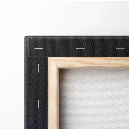 Close-up of black-stretched canvas with natural wood frame and white textured fabric surface.