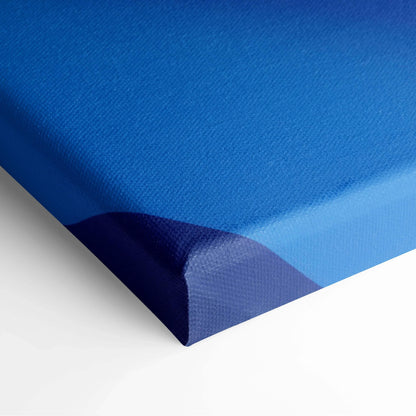 Blue-toned abstract digital canvas art with smooth gradient and textured surface on stretched frame.