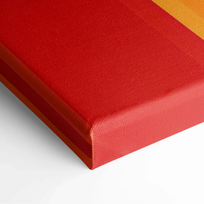 Close-up of vibrant red and orange abstract digital art on textured canvas wall art.