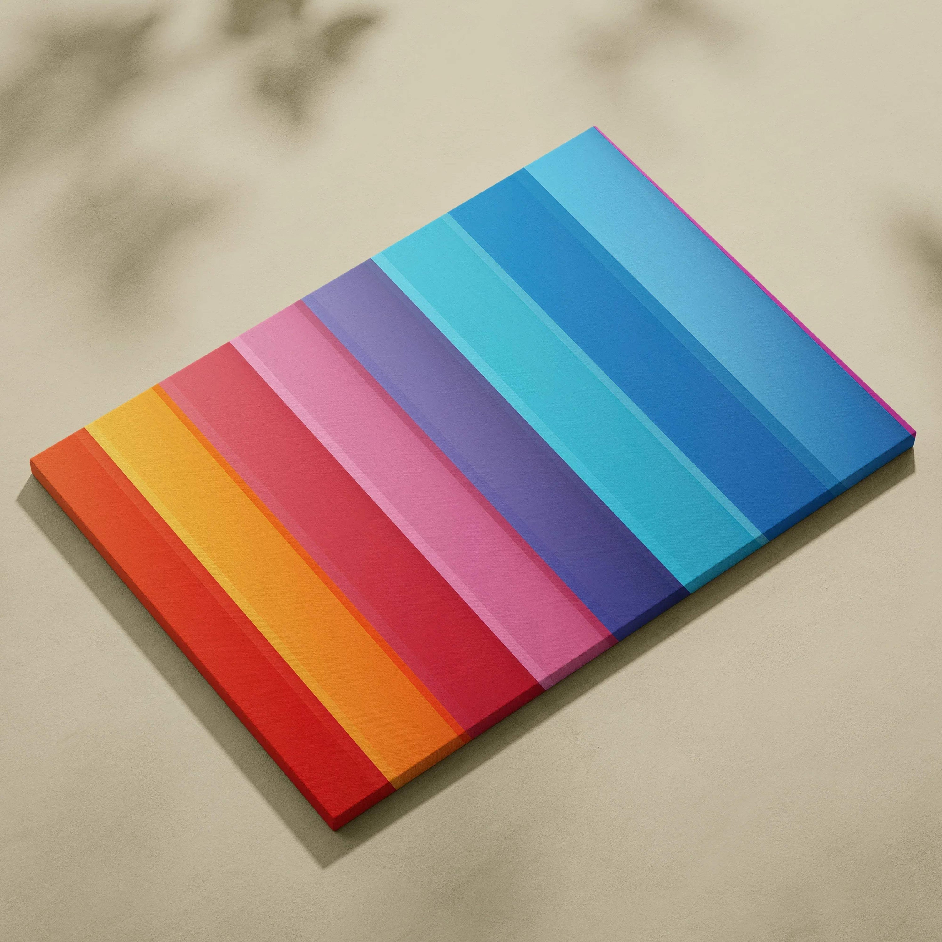 Abstract canvas art with vibrant vertical stripes in red, orange, pink, purple, and varying blue tones.