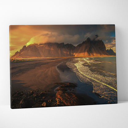 Cinematic volcanic beach sunset canvas with dramatic mountains and glowing waves