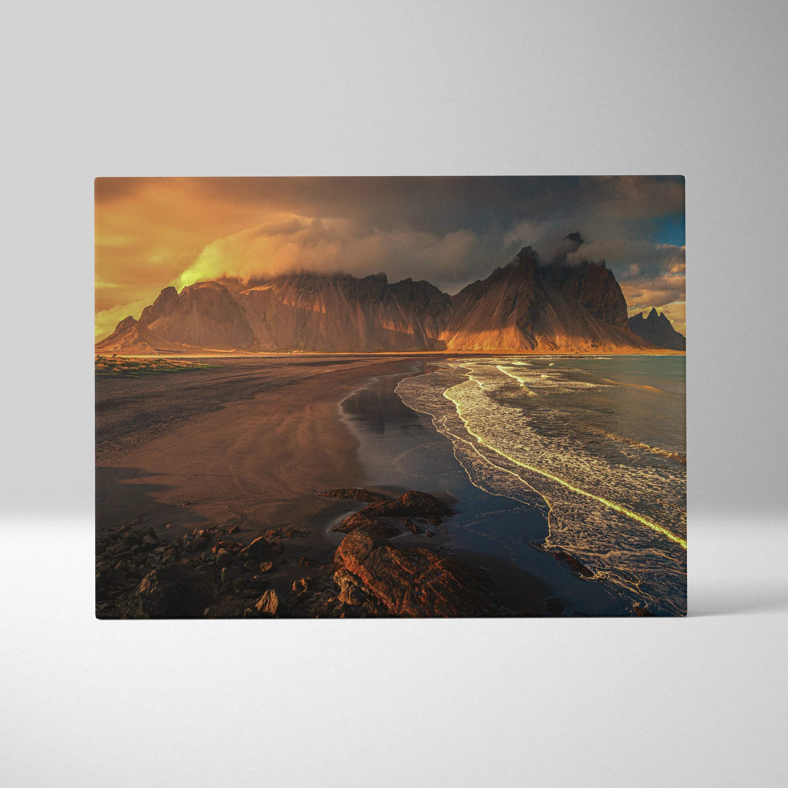 Cinematic volcanic beach sunset canvas with dramatic mountains and glowing waves