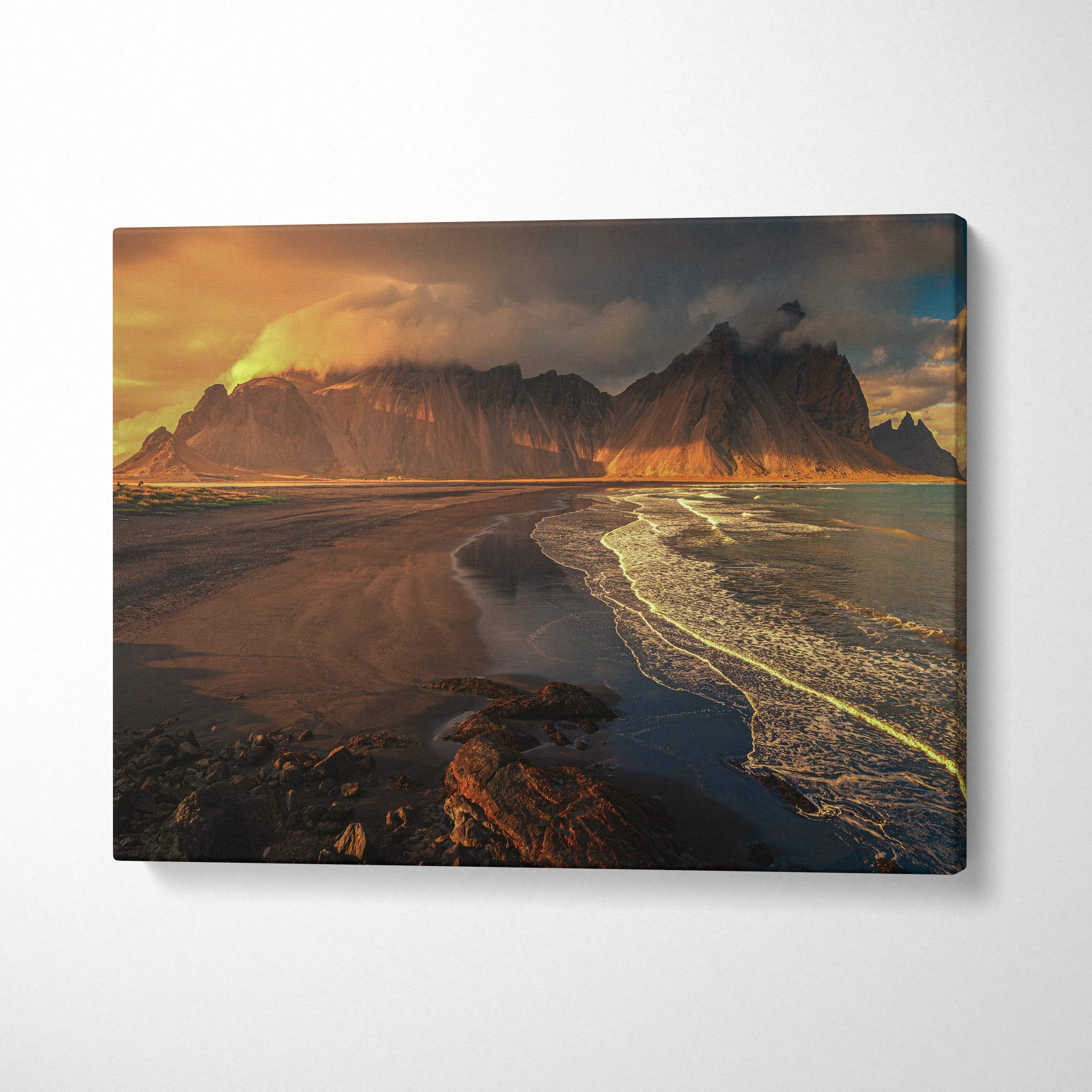 Cinematic volcanic beach sunset canvas with dramatic mountains and glowing waves