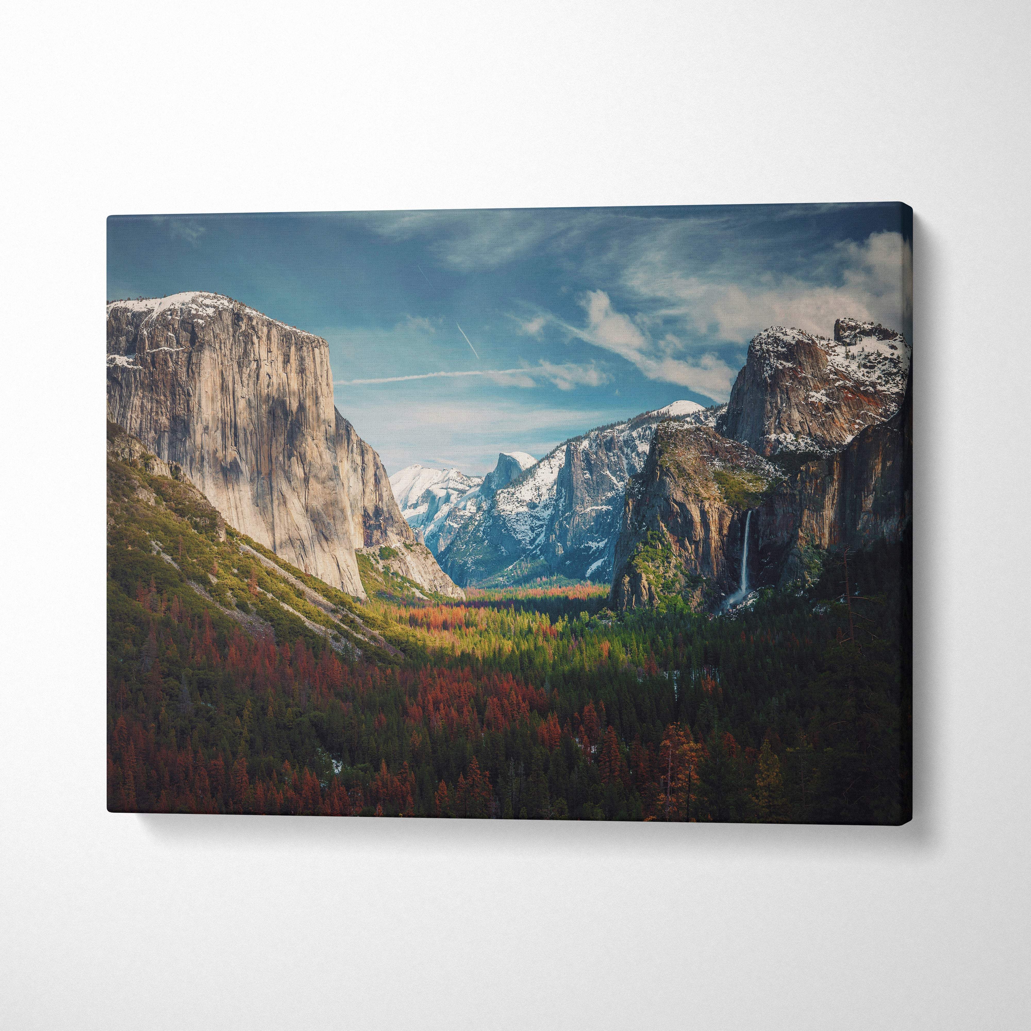 A rectangular canvas print of yosemite valley mountain landscape with snow-capped peaks autumn forests and waterfall decor