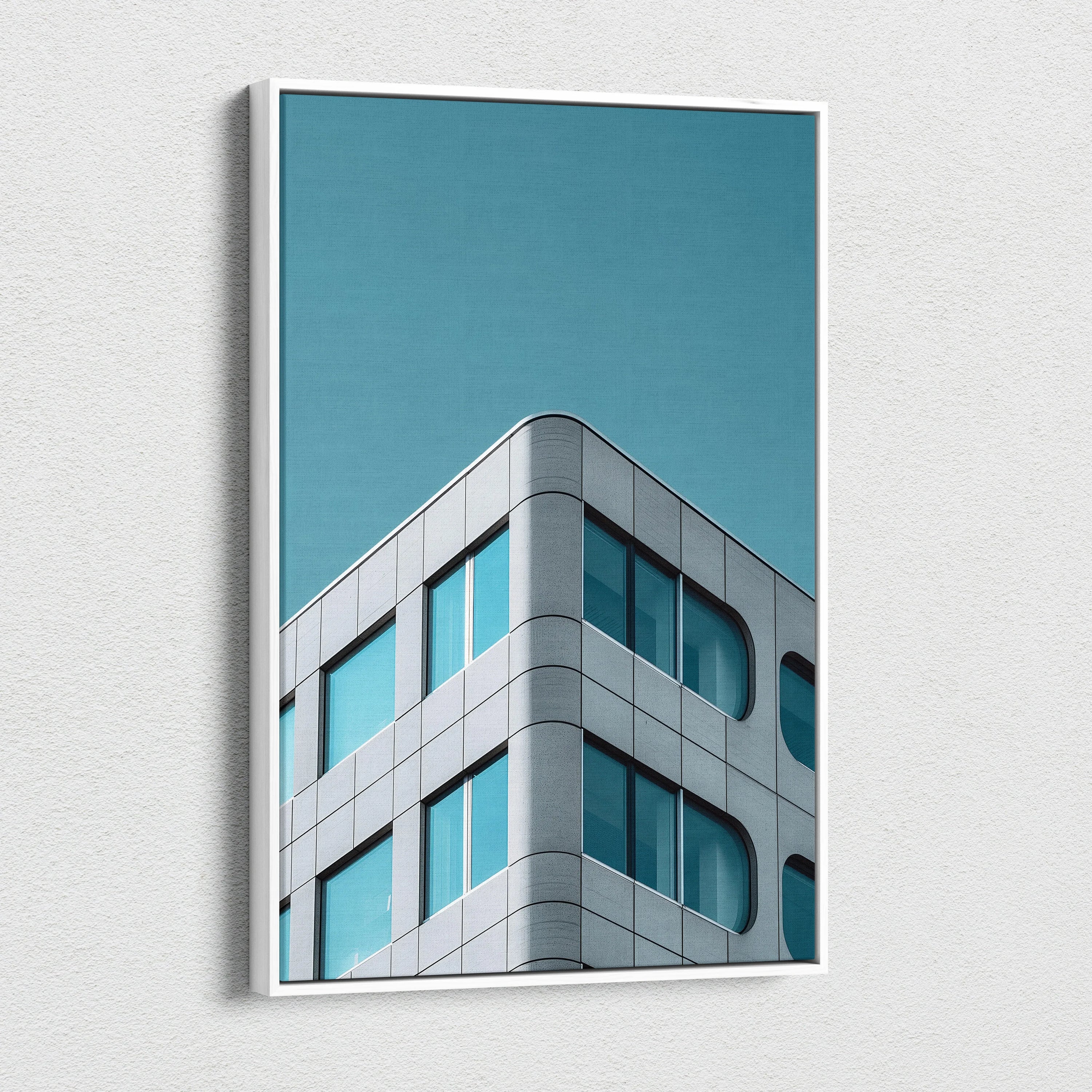 Modern architecture digital art on vertical canvas wall art with blue sky background.