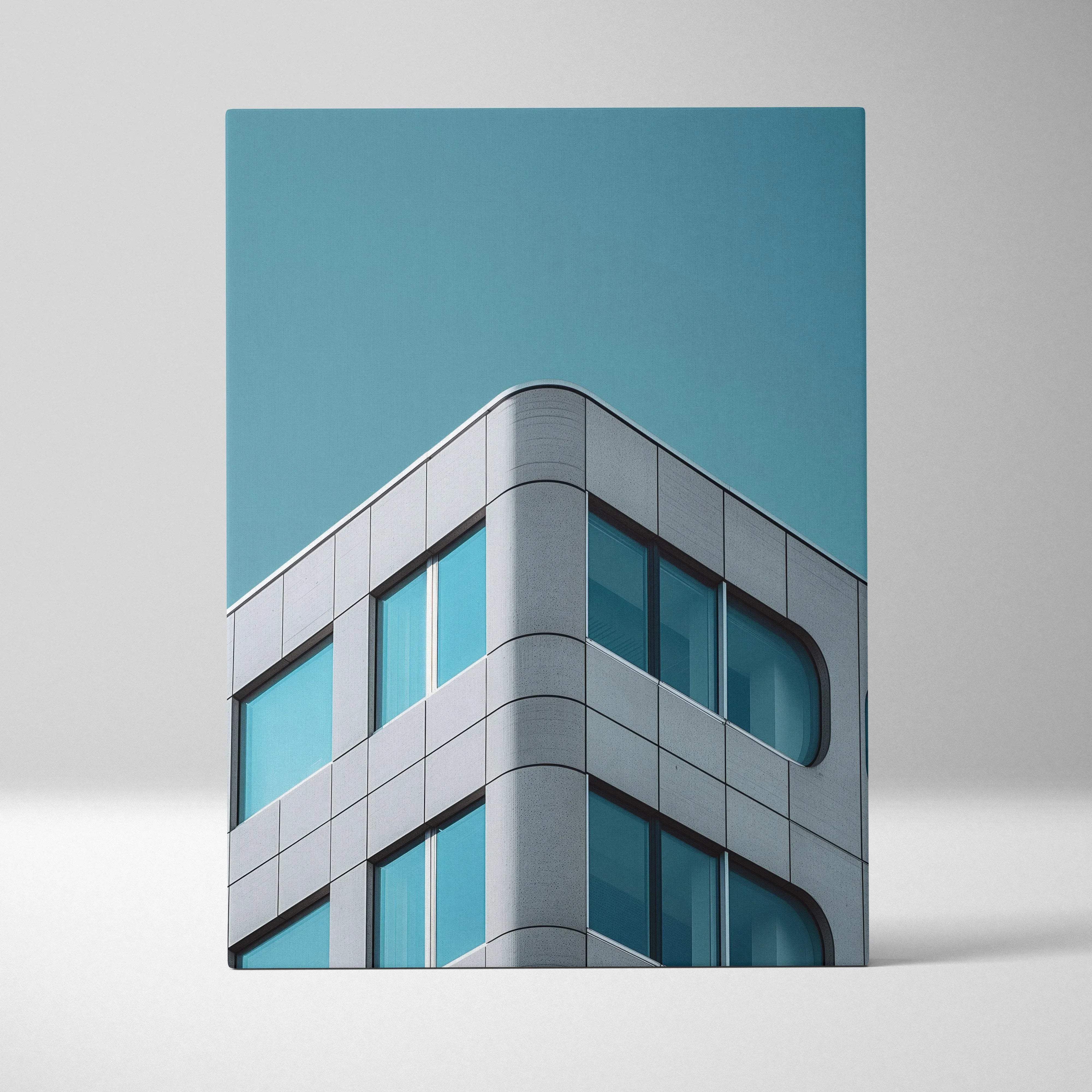 Modern architecture corner building canvas wall art with sleek gray metallic panels and teal glass windows against a blue sky