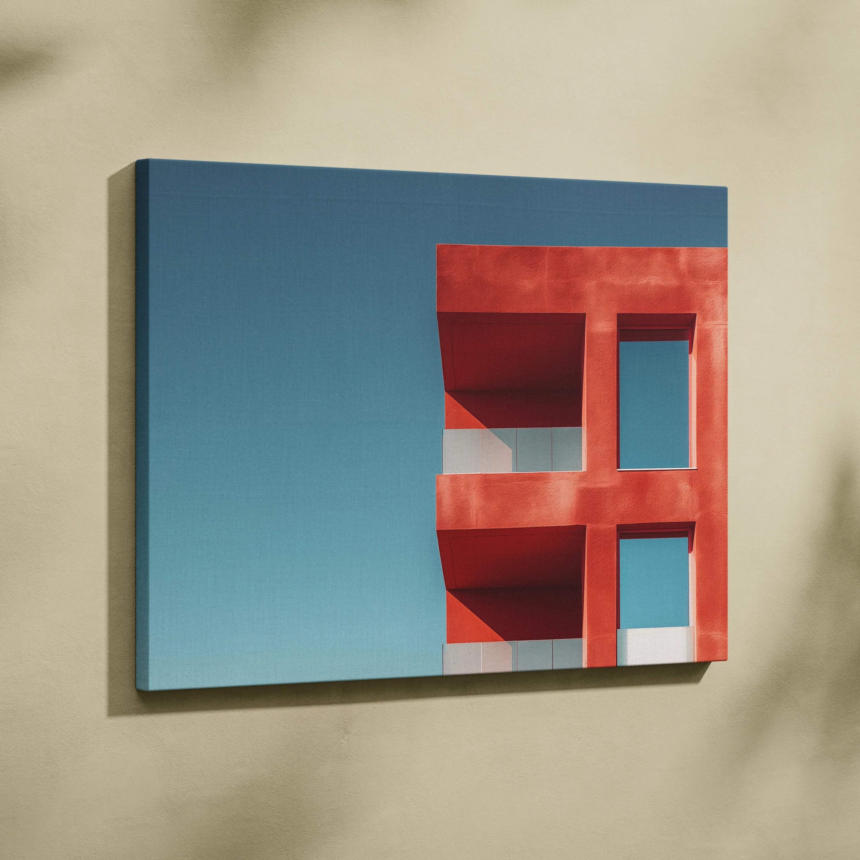 Red modern building detail against blue sky on horizontal canvas wall art print.
