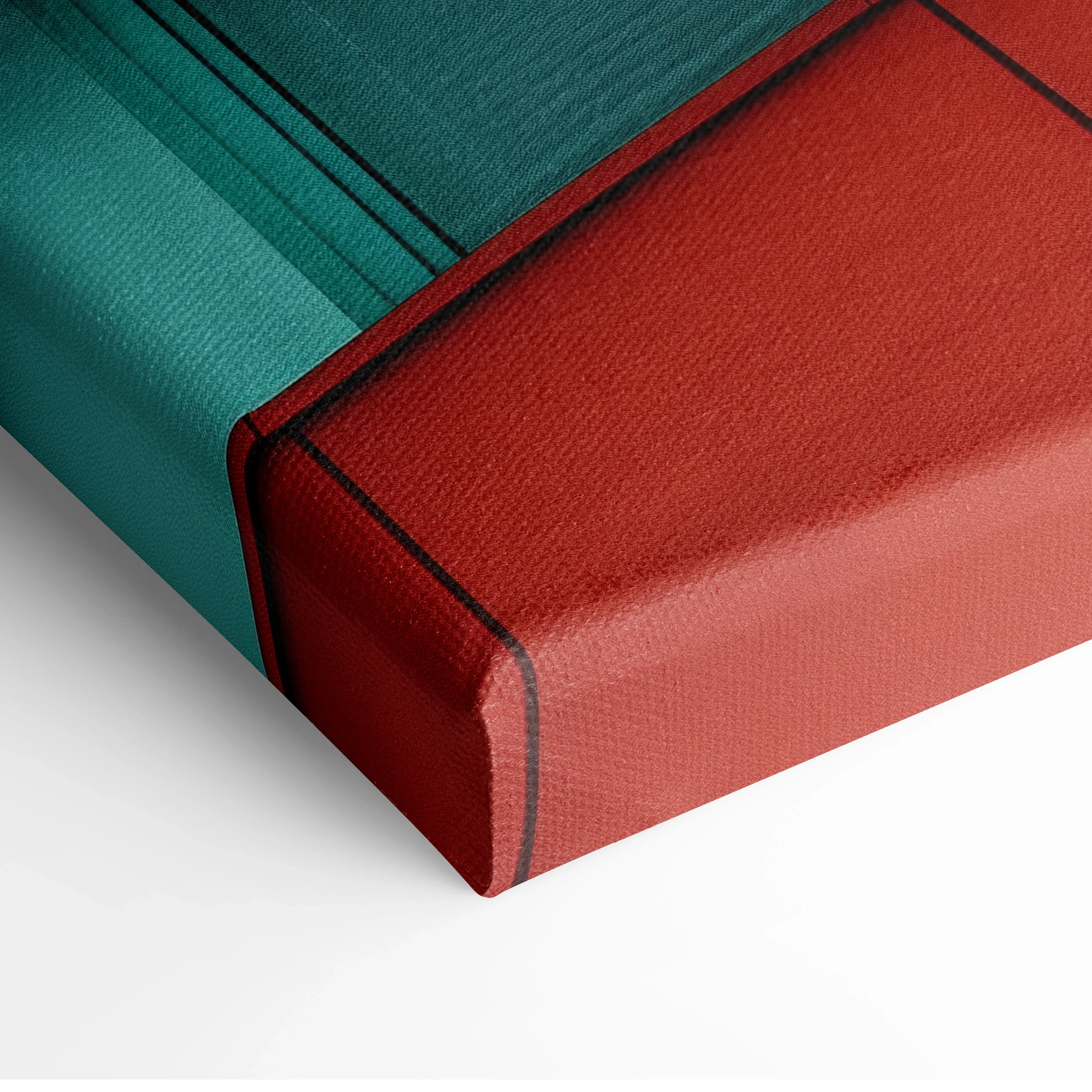 Close-up of teal and rust red canvas wall art with visible texture and black edge lining on canvas art wrap.