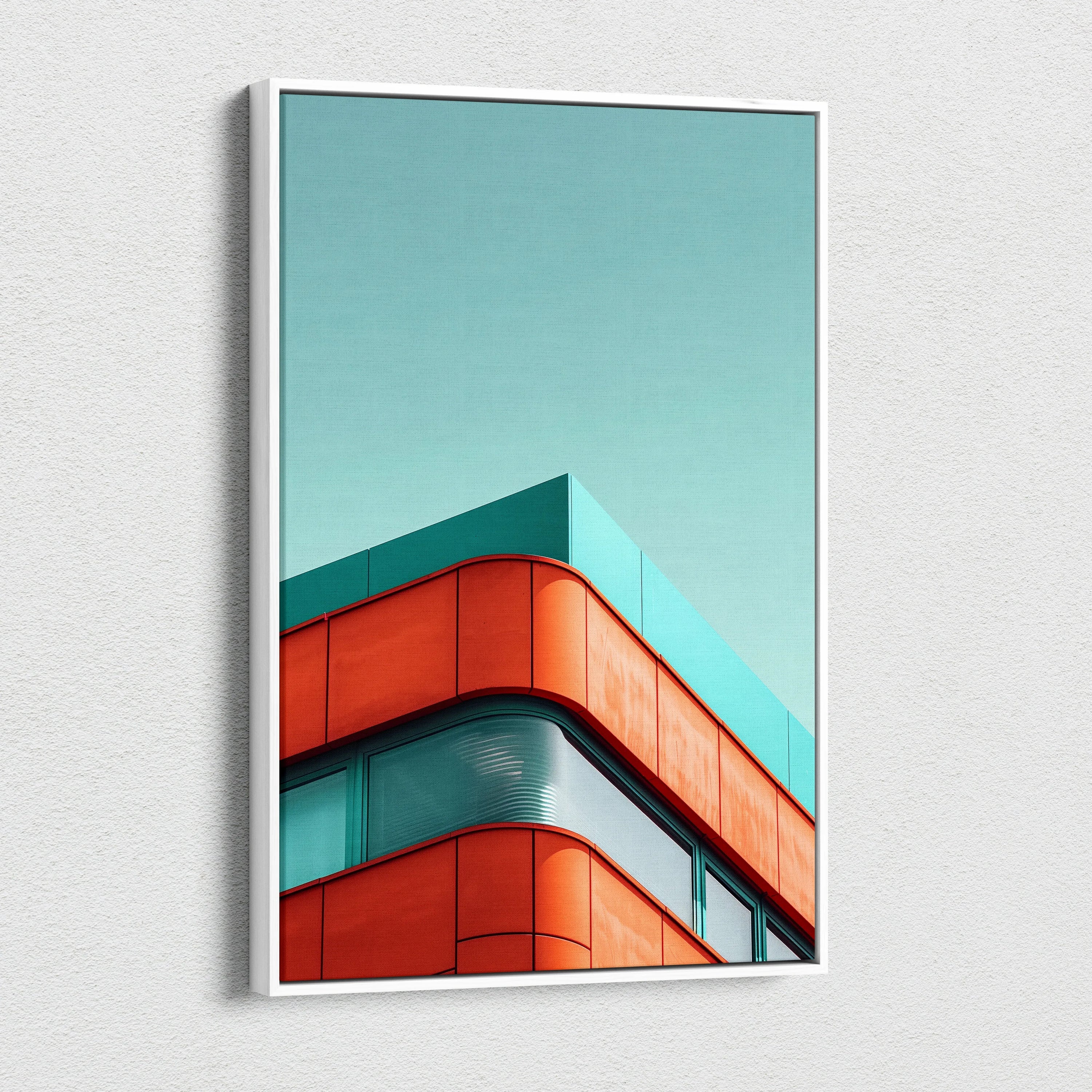 Vertical canvas wall art featuring modern building corner with red and teal architectural elements against clear blue sky.