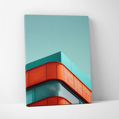 Vertical canvas wall art featuring modern building architecture in teal and orange tones against clear sky.