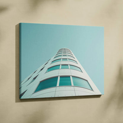 Modern white curved building with teal-tinted windows on square canvas wall art.