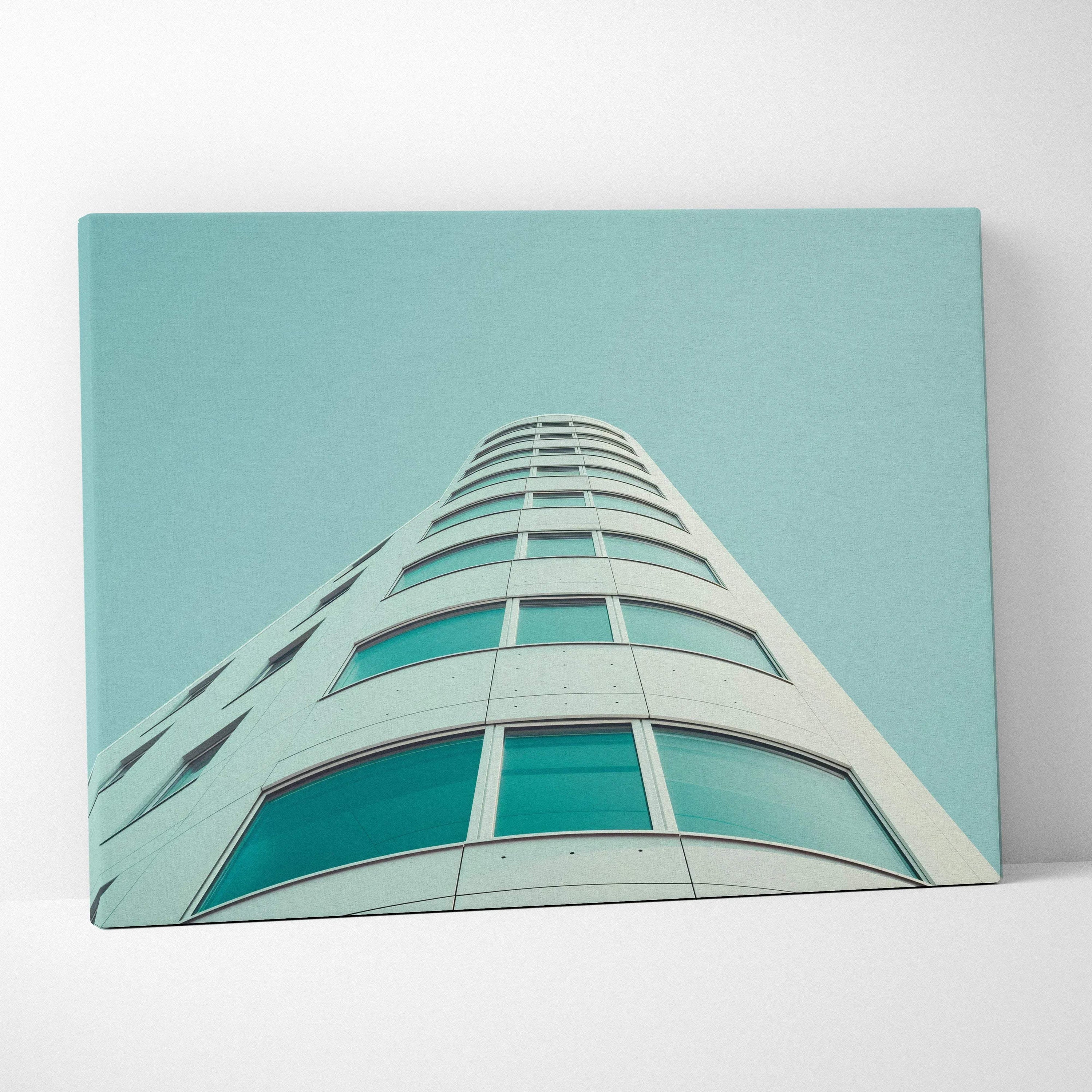 Canvas wall art featuring a modern white building with curved edges against a clear blue sky.