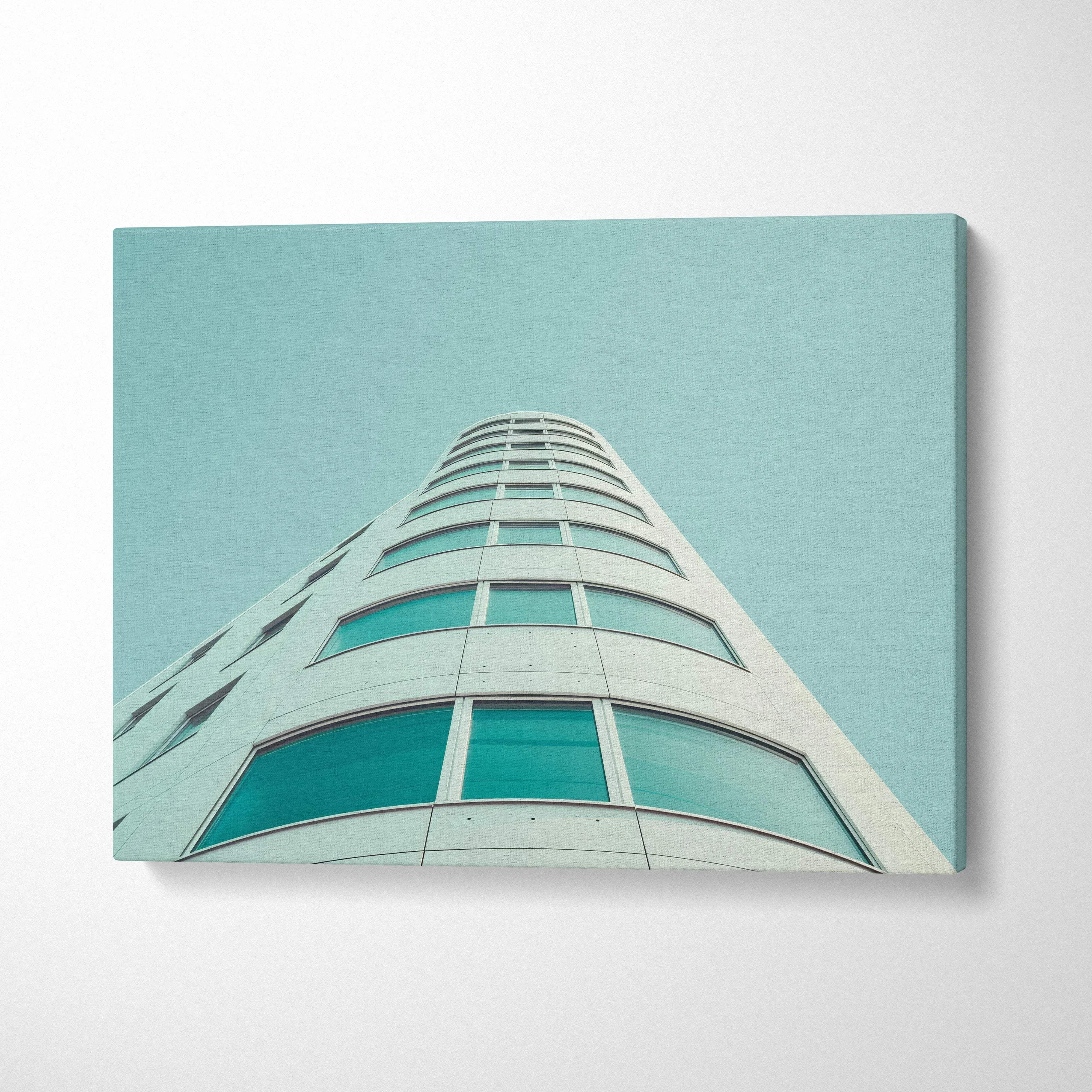 Modern curved building architectural digital art on canvas wall art with teal sky background.