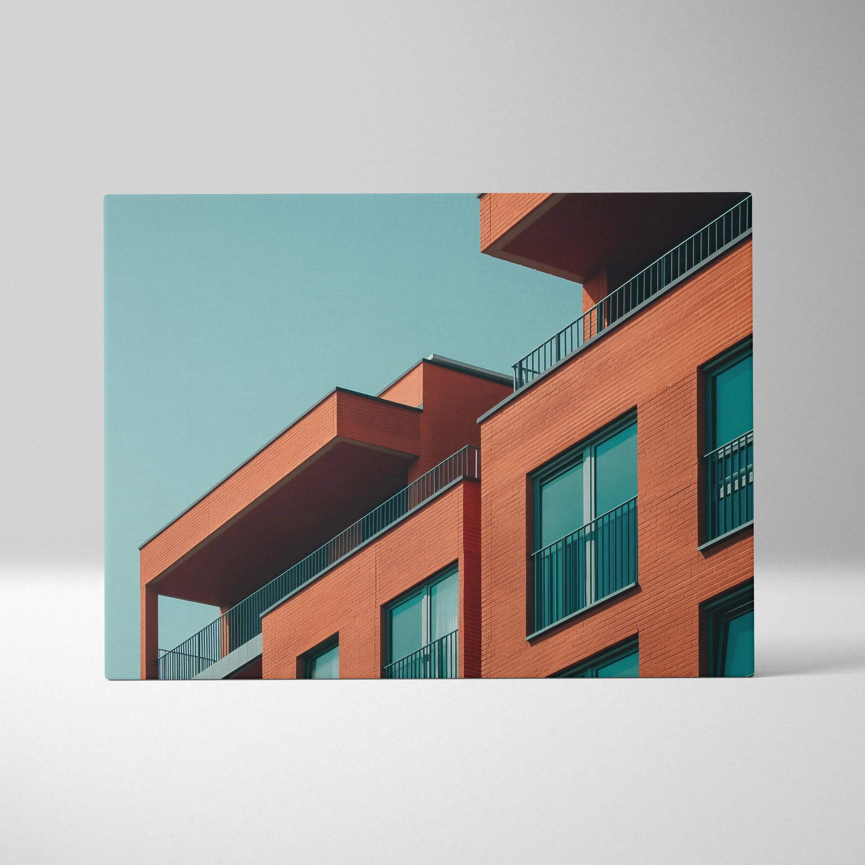 Modern building architecture in vibrant orange tones on canvas wall art with clear turquoise sky background.