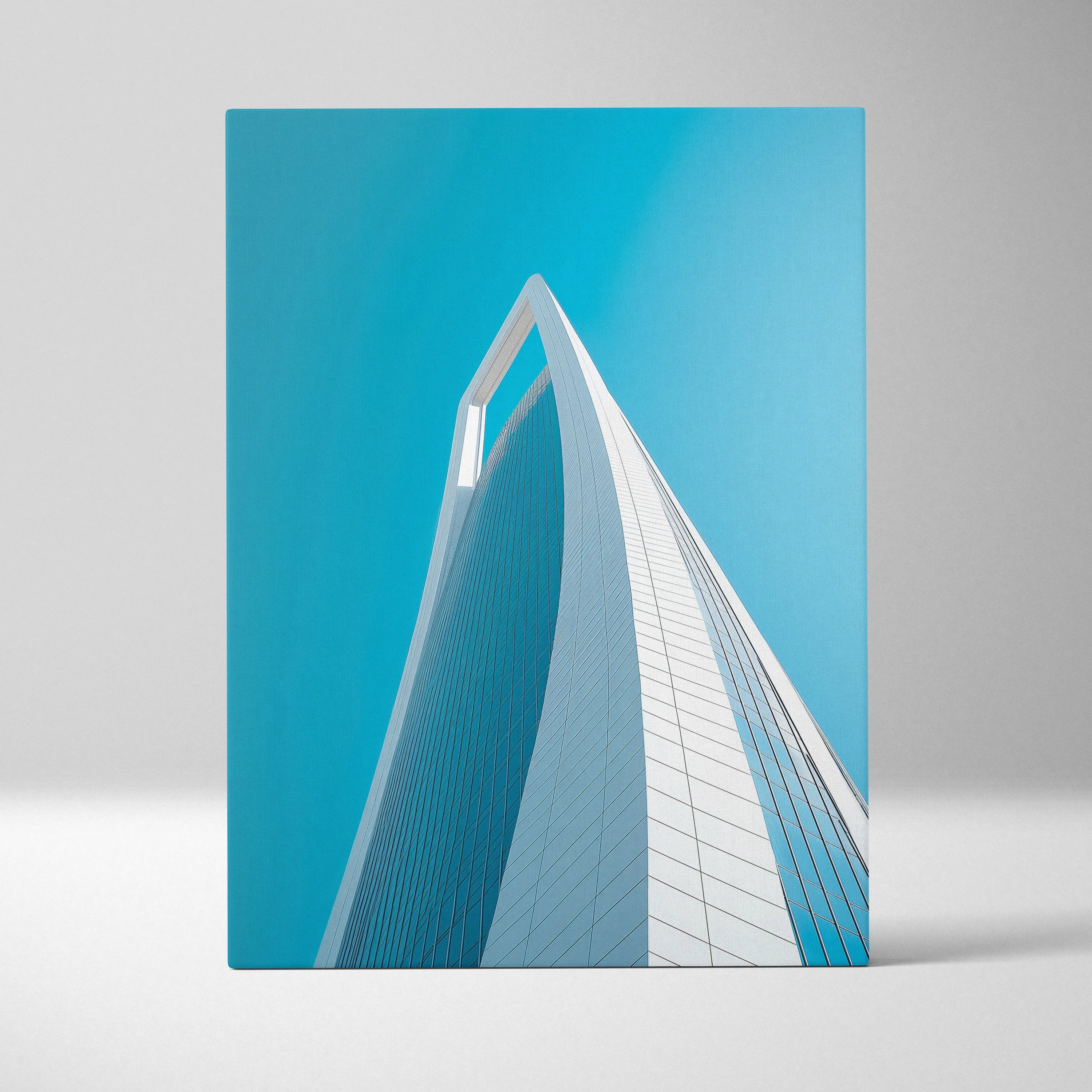 Vertical canvas wall art featuring modern white architectural structure against clear blue sky.