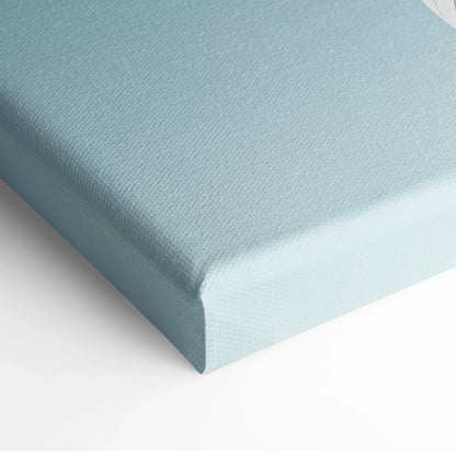Light blue stretched canvas wall art corner close-up with textured canvas material.