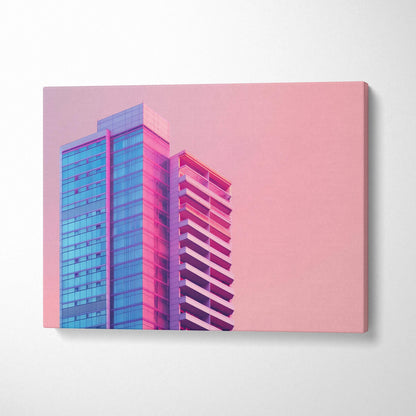 Modern architecture canvas wall art featuring blue and pink building against a soft pink background.