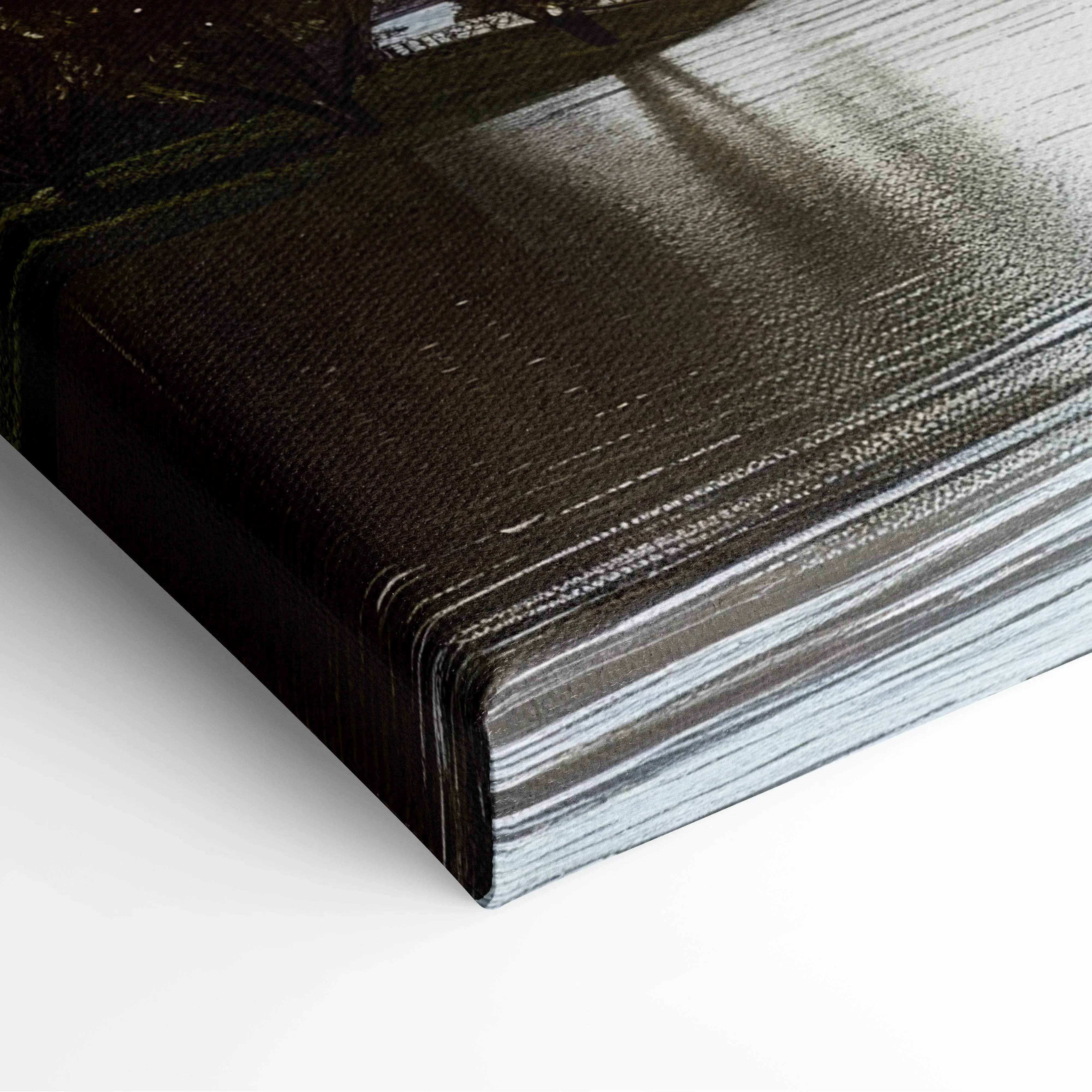 Black canvas print with textured brushstroke surface and silver-gray gradient in tall waterfront tower modern art