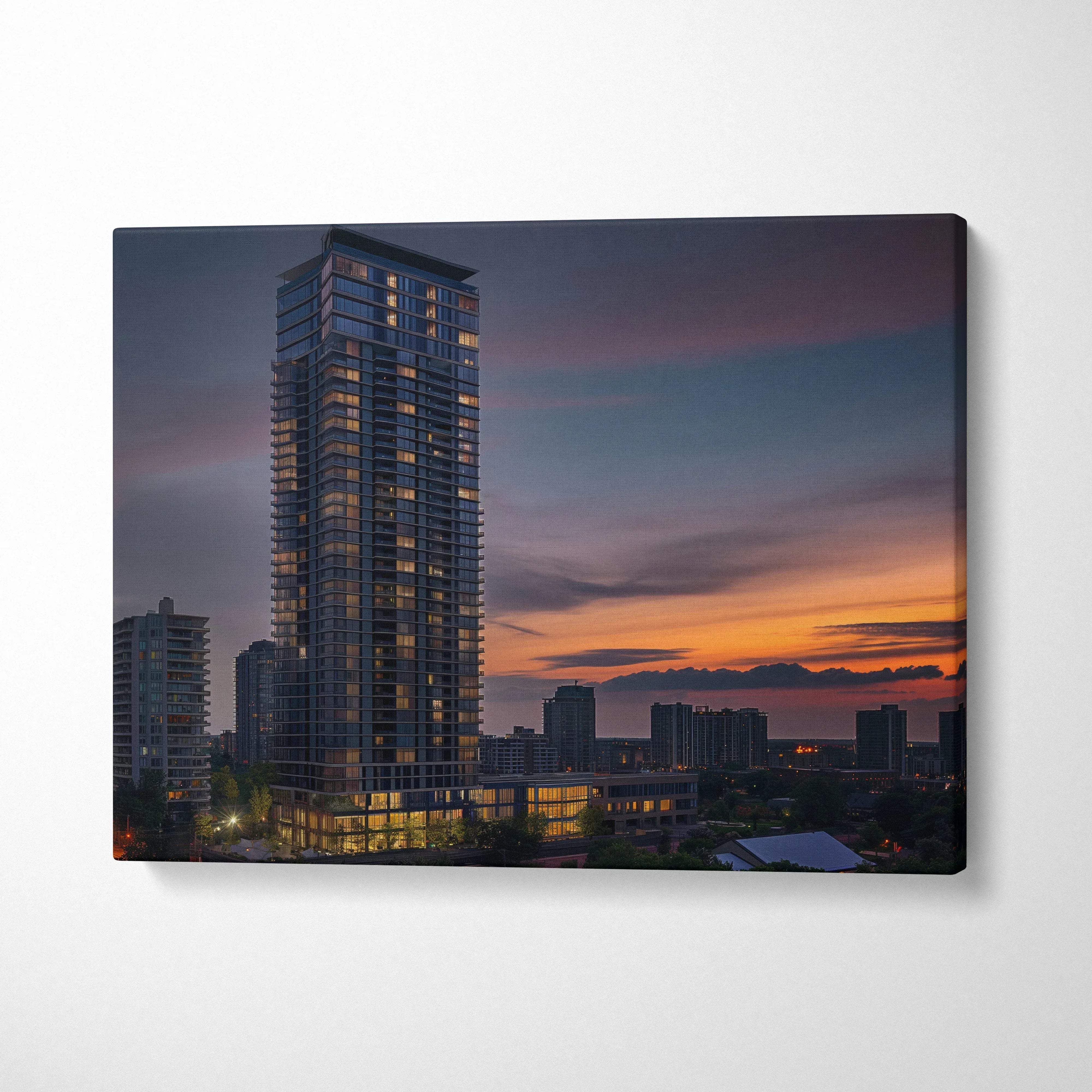 Canvas wall art featuring a modern high-rise building at dusk with a colorful sunset sky background.