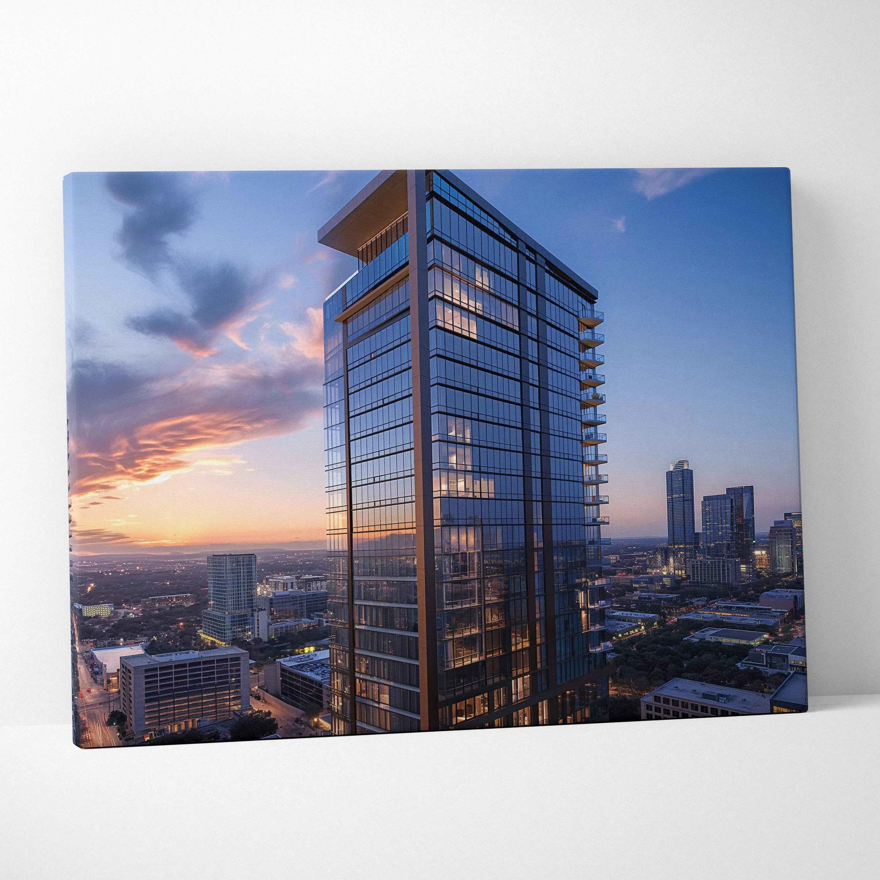 High-resolution canvas wall art featuring a modern glass skyscraper at sunset with cityscape background.