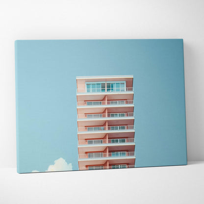 Canvas wall art featuring modern pink building architecture against a clear blue sky background.