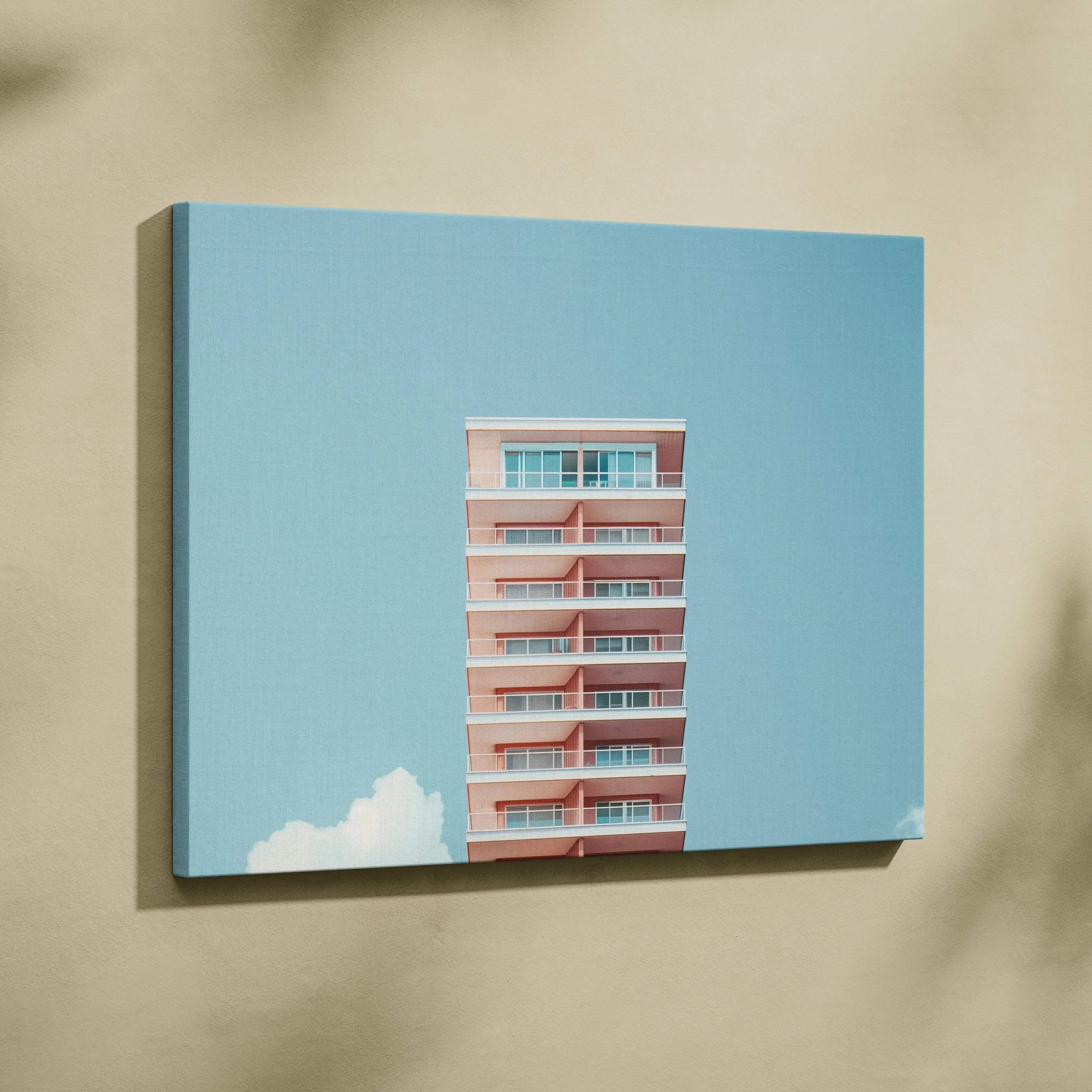 Canvas wall art featuring modern pink building against a clear blue sky with white clouds.