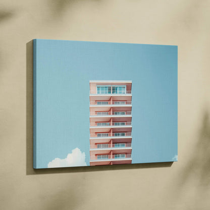 Canvas wall art featuring modern pink building against a clear blue sky with white clouds.