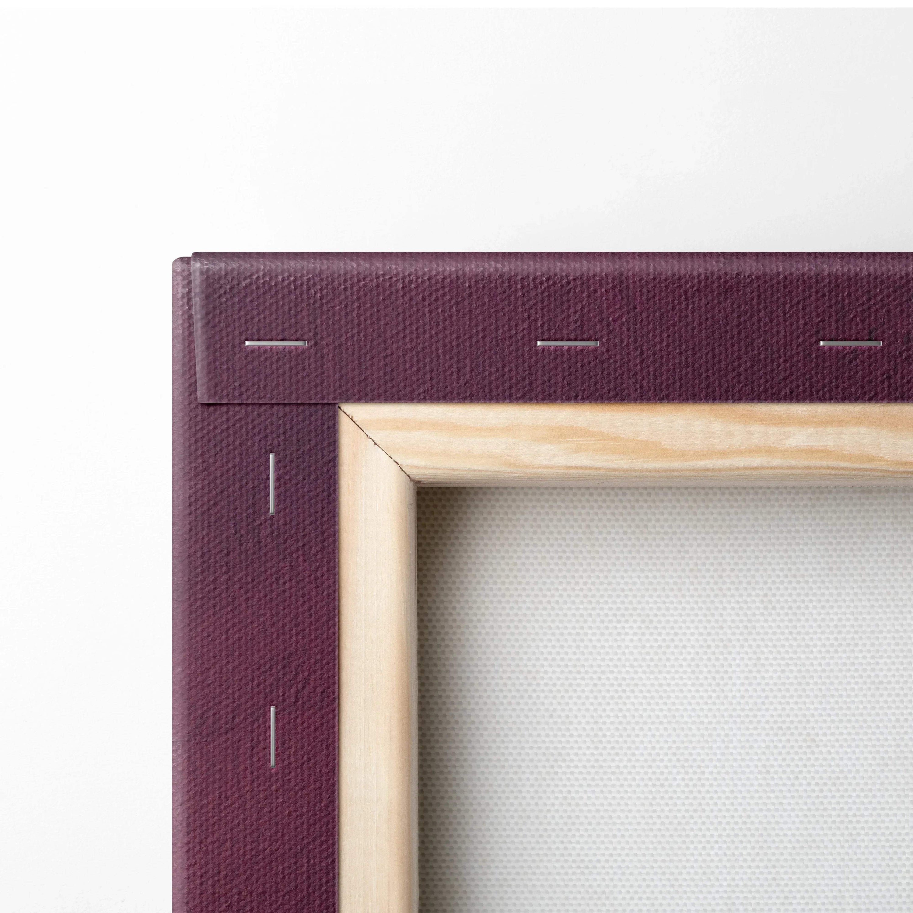 Close-up of wooden frame with burgundy canvas stretched and stapled for wall art canvas print.