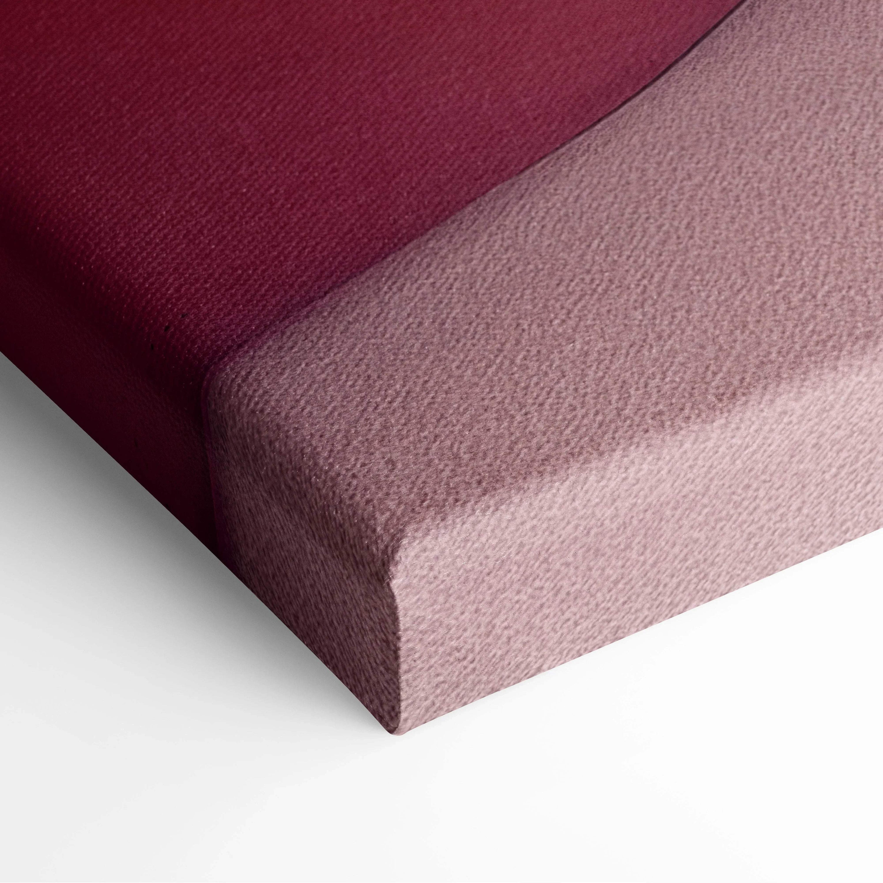 Close-up of canvas wall art showing burgundy and soft pink textured fabric wrapped around the edges.