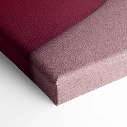 Close-up of canvas wall art showing burgundy and soft pink textured fabric wrapped around the edges.
