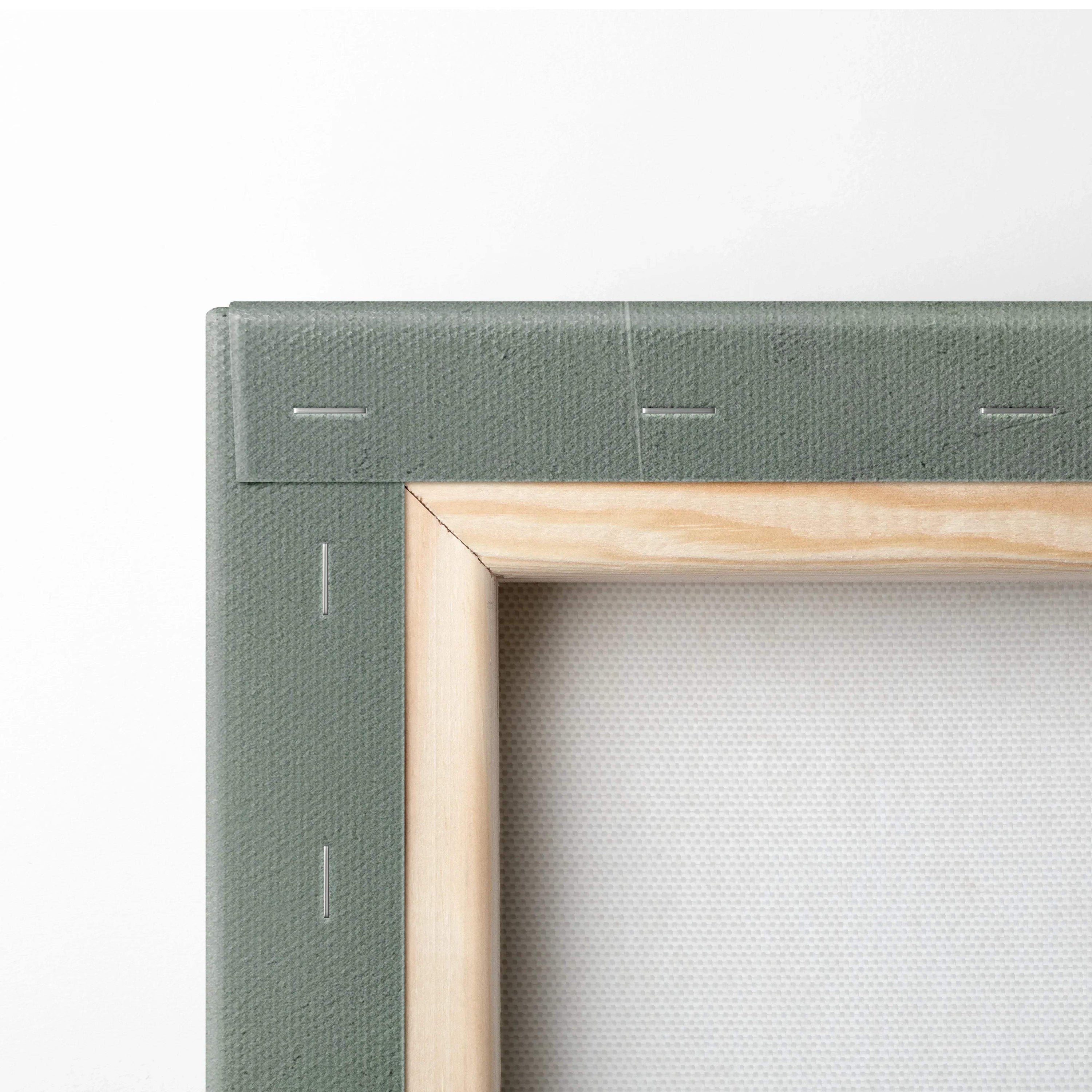 Close-up of wooden frame and green canvas backing with visible staples on stretched canvas wall art.