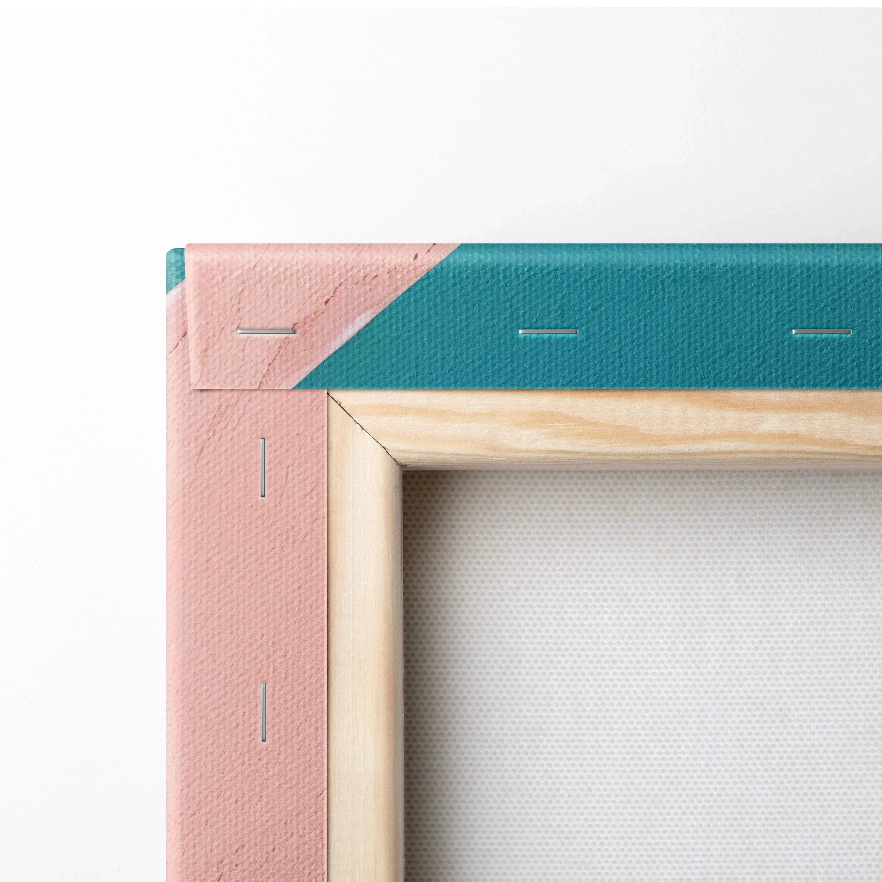 Close-up of a stretched canvas corner with pink and teal edges and wooden inner frame for wall art display.