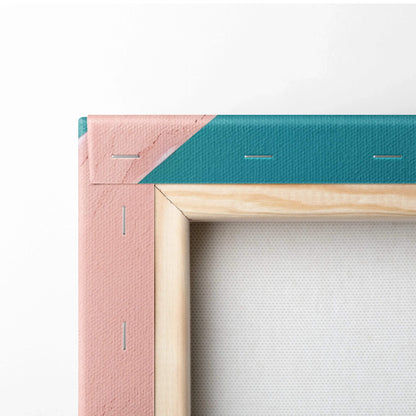 Close-up of a stretched canvas corner with pink and teal edges and wooden inner frame for wall art display.