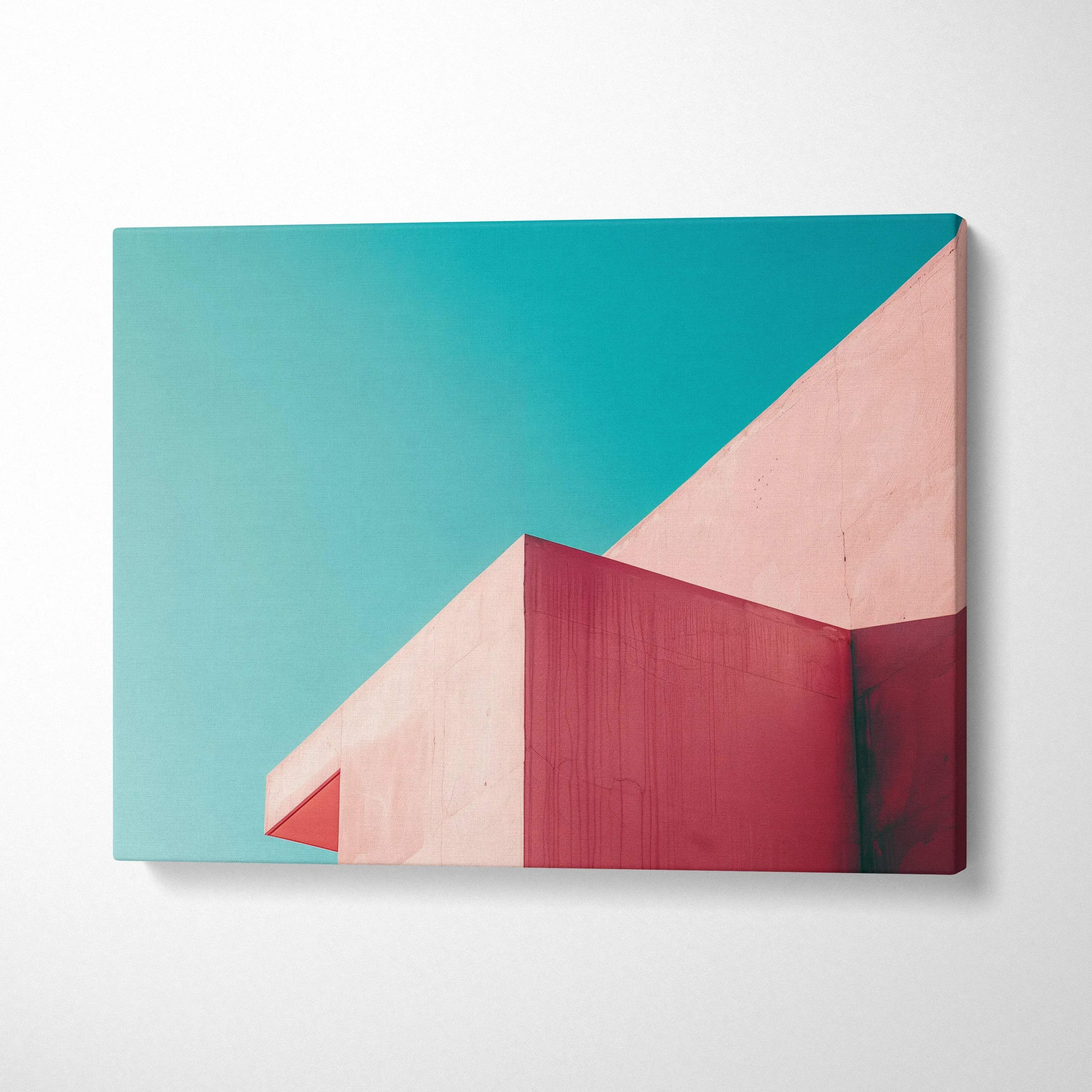 Modern abstract architectural canvas art with teal sky and pink geometric building shapes.