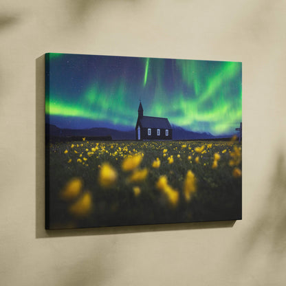 Black wooden church under vibrant green auroras in yellow wildflower field canvas print