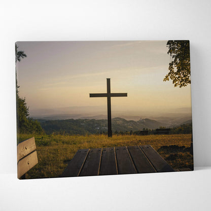Canvas wall art featuring a wooden cross at sunset over rolling hills with golden light.