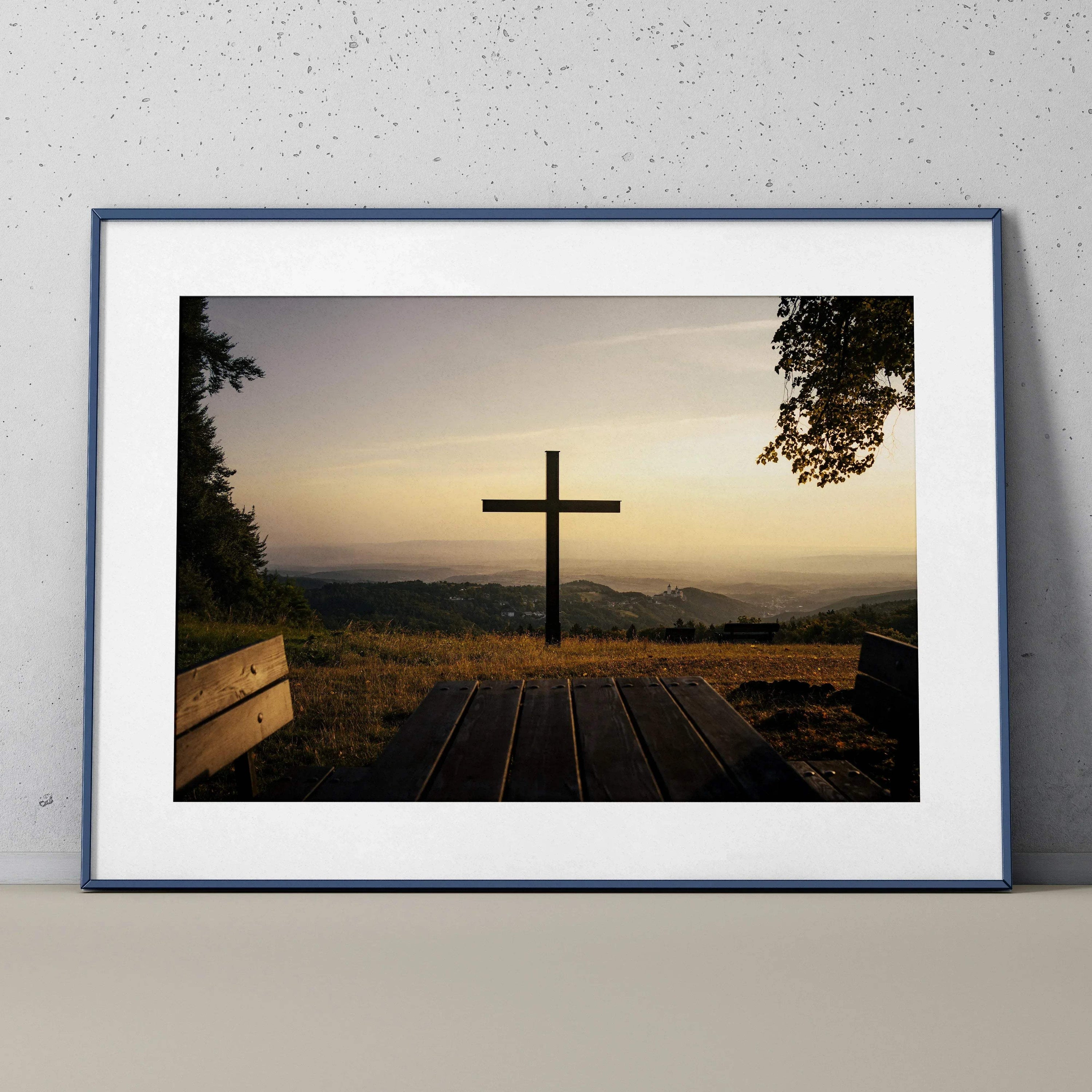 Inspirational faith art poster featuring a cross silhouette at sunset with scenic mountain view, framed wall art.