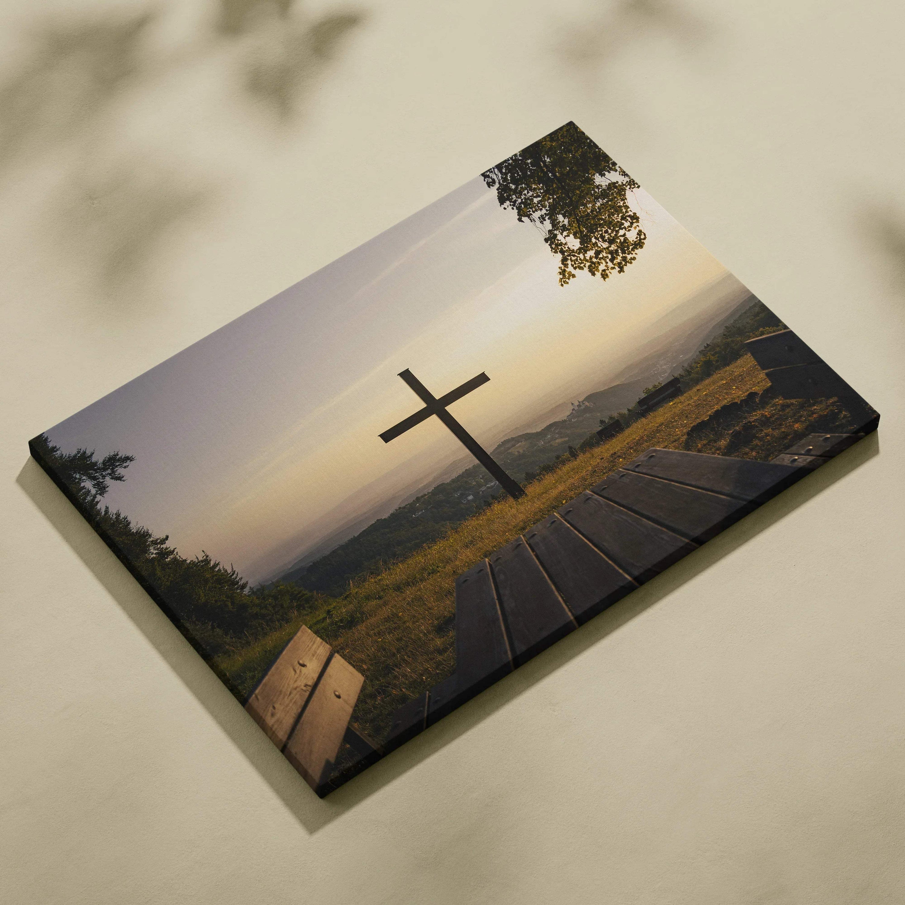 Nature landscape canvas wall art featuring a wooden cross at sunset over rolling hills.