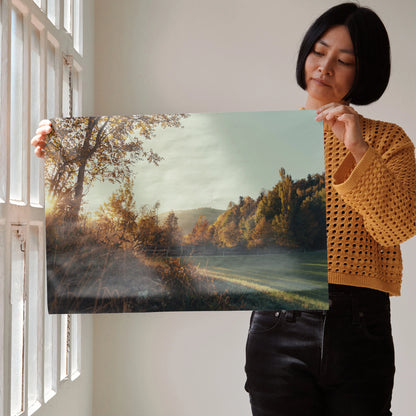 Autumn landscape wall art poster featuring vibrant orange and yellow leaves against a soft sky backdrop.