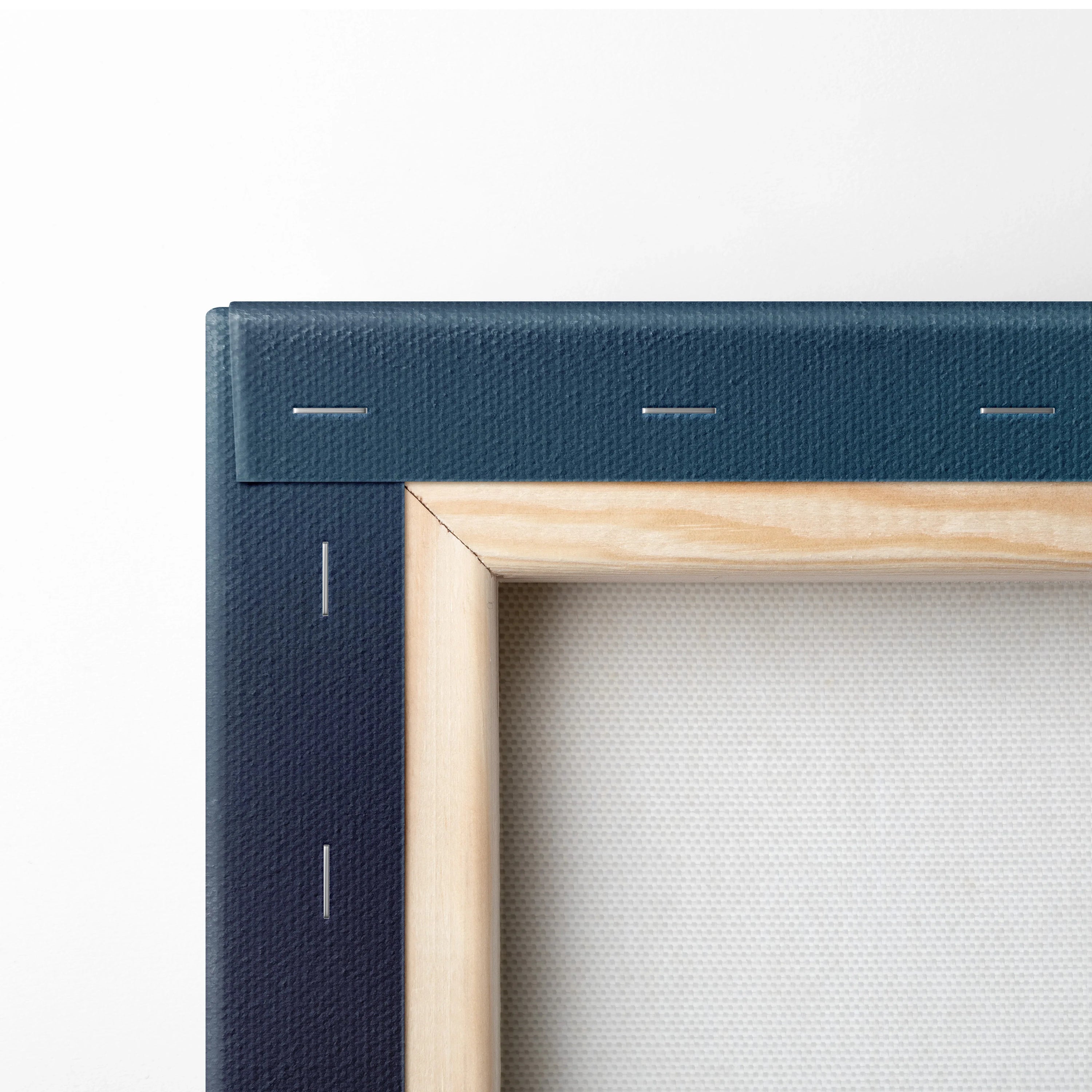 Close-up of natural wood frame with navy blue stretched canvas corner for wall art canvas art.