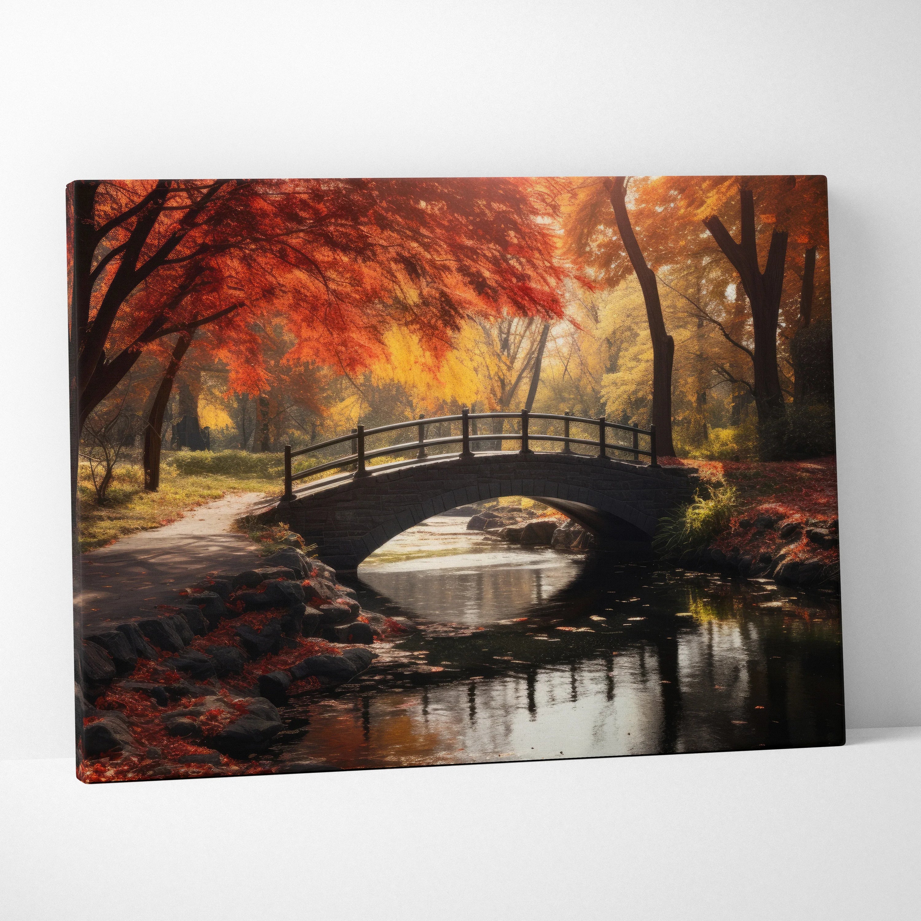 Autumn foliage canvas art with vibrant orange and red trees over a stone bridge and reflective water canal wall art.